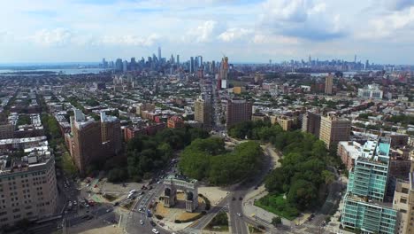 Cinematic-parallaxing-aerial-of-Brooklyn's-Grand-Army-Plaza-with-NYC-skyline-4K