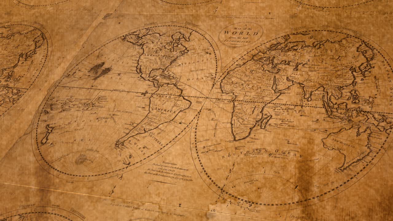 Old maps of the world repeated across brown paper background