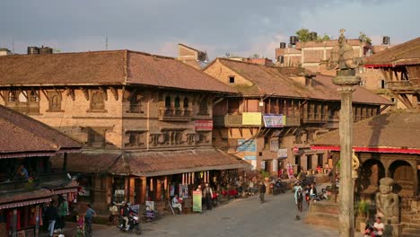 people in bhaktapur square in nepal, old temple buildings in bhaktapur nepal, beautiful temples in the ancient city of bhaktapur, a unesco world heritage site for its culture and cultural significance