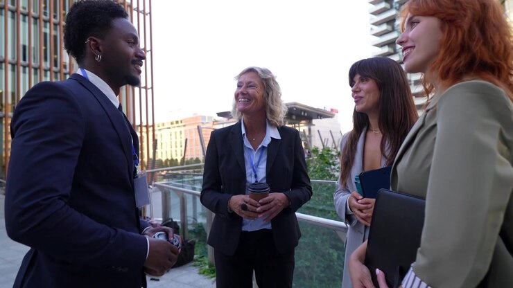 Diverse Business Professionals Networking Outdoors in City