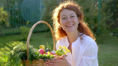 woman holding basket of fresh vegetables in garden