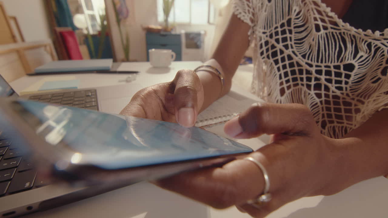 Hands of African-American Woman Online Messaging on Phone Home