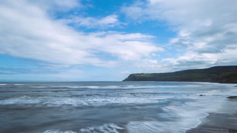 Timelapse-from-Robin-Hoods-Bay-towards-Ravenscar,-Summer-sunshine-and-waves