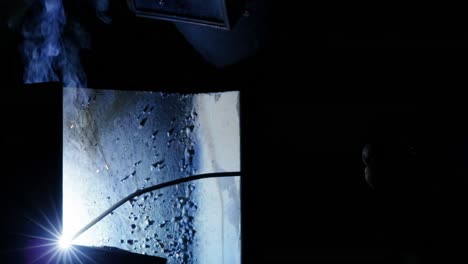 welder welding a metal