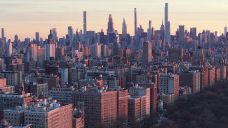 aerial view of the new york city skyline at dusk. shot in harlem looking south towards midtown manhattan.
