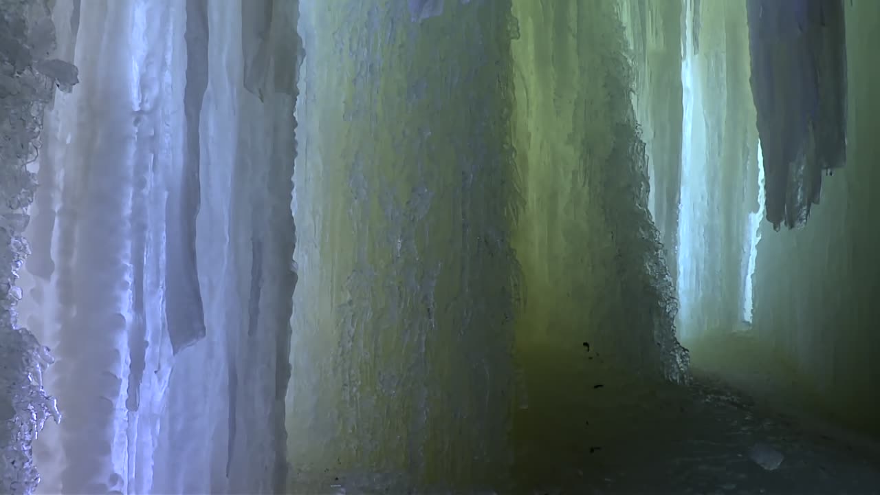 Interior view of frozen ice walls inside Eben Ice Caves, Michigan, pan right