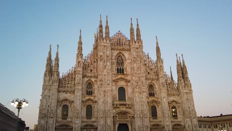 italian milano skyline with duomo famous cathedral, landmark of famous architecture in summer, panning view
