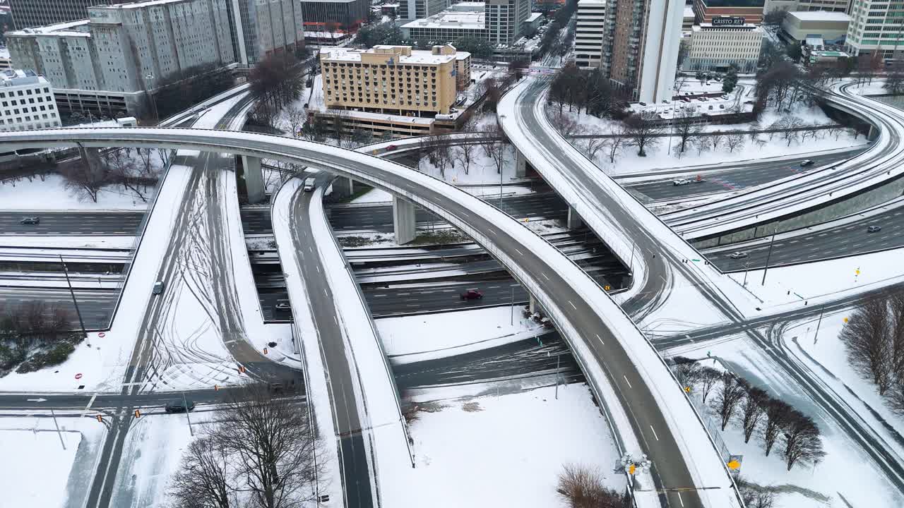 Static aerial shot of snow covered interstate ramps in Atlanta, Georgia on January 10th 2025.