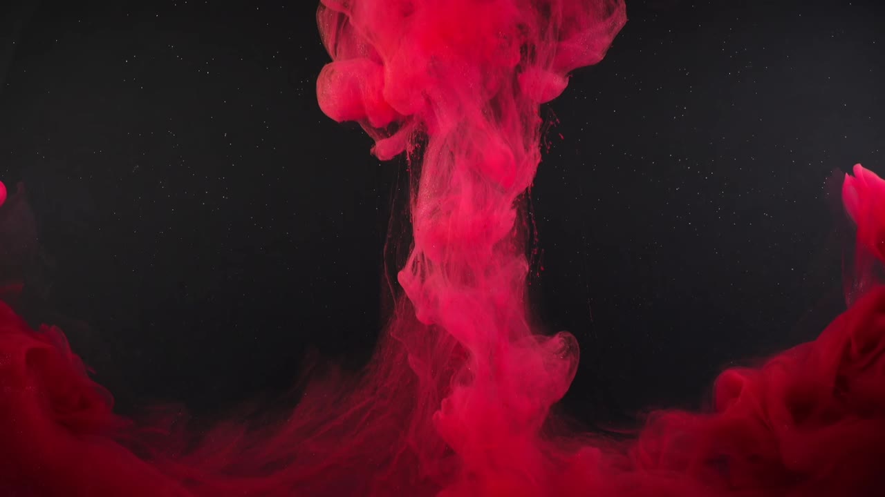 Abstract forms. Shooting on a black background. Mixing of paints