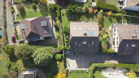 Residential-area-in-Lausanne-town:-Houses,-buildings,-a-road-and-garden-in-the-capital-city-in-Vaud,-Switzerland,-drone-aerial-view