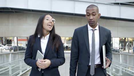 professional business people talking on street