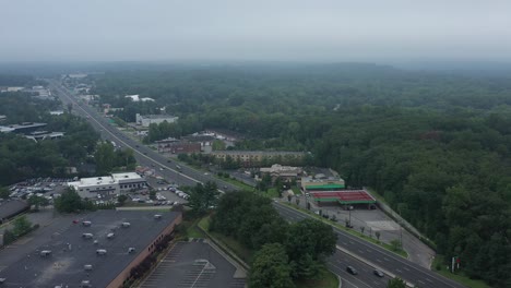 Aerial-footage-of-suburban-highway-into-fog