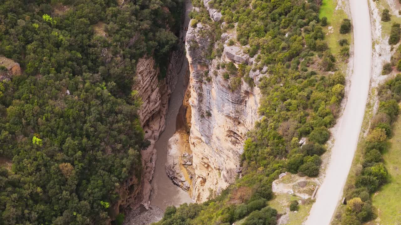 Aerial view of Osum Canyon in Berat, Albania with road and lush green landscape