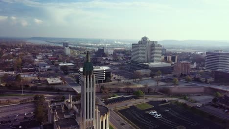 aerial drone footage of a cathedral and smog-covered city