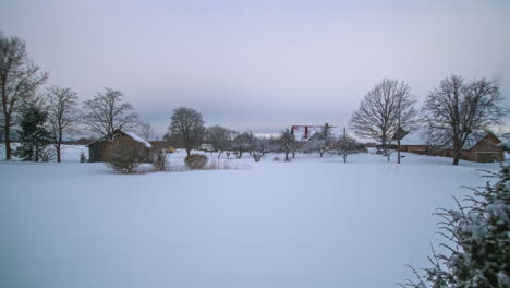 Snowy-Village-Countryside-Landscape-in-Winter,-Timelapse-in-Latvia