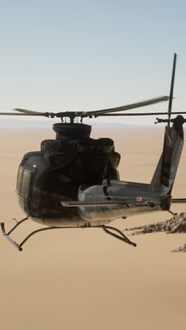 a helicopter flies over a desert