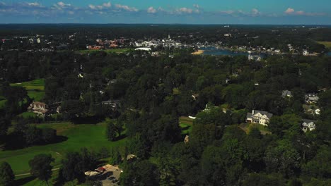 Drone-footage-heading-inland-over-coastal-mansions-in-the-northeast