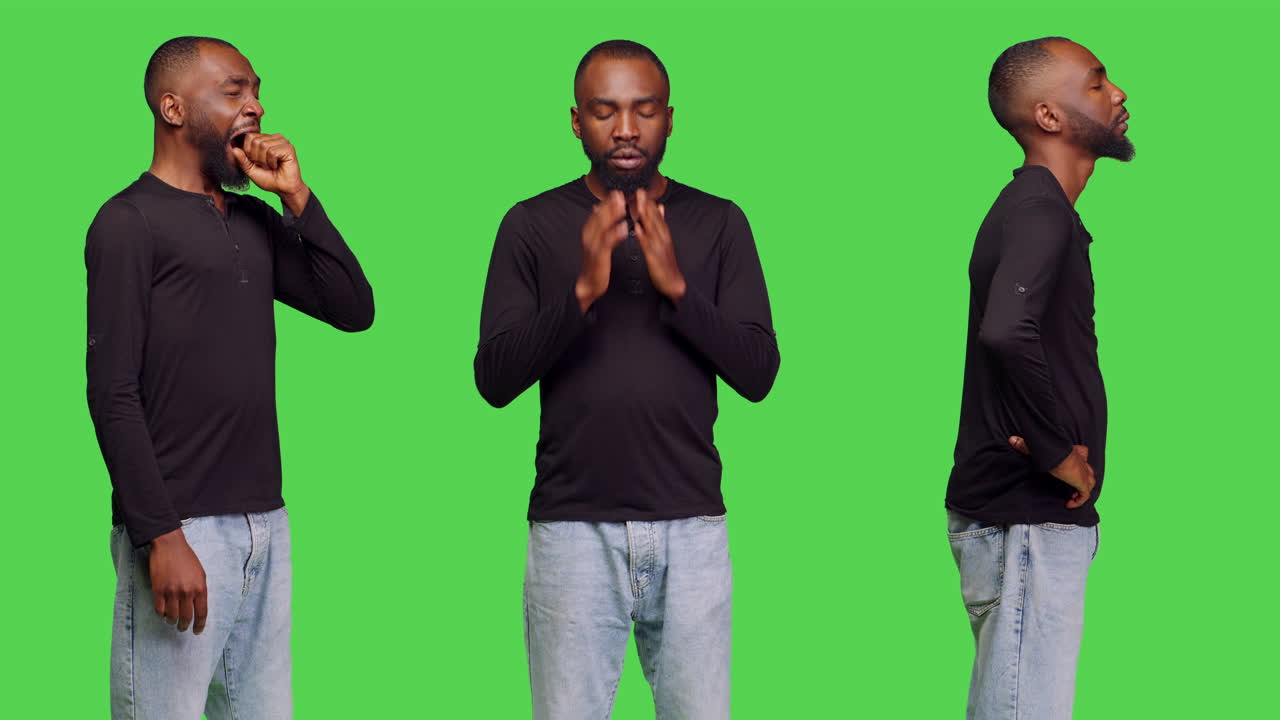Man posing in front of green screen