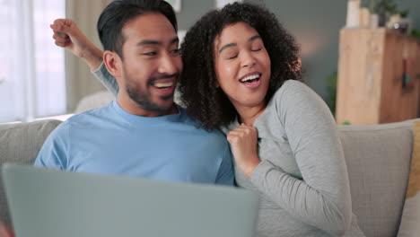 Happy-and-excited-couple-with-a-laptop-on-a-video