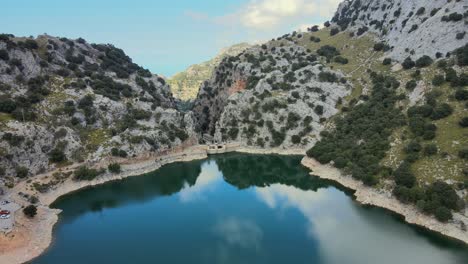 explore the breathtaking views at gorg blau, a serene reservoir nestled in the sierra de tramuntana mountains of mallorca.