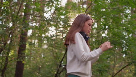 young woman walking in a forest