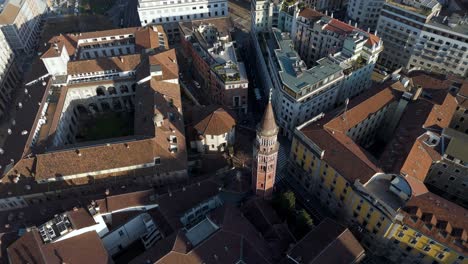 aerial top down milan downtown main square , warm afternoon light on old gothic architecture european city