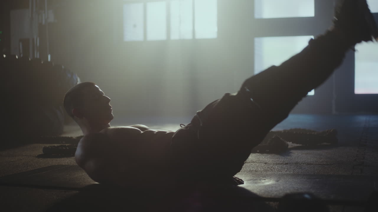 Man doing abdominal workout in a gym