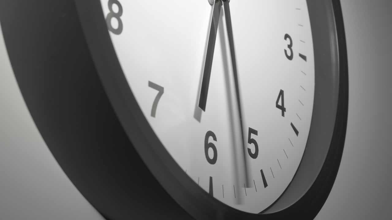 Clock Face in Time Lapse on White Wall in Office