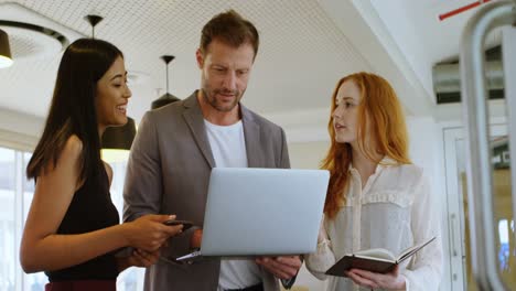 business colleagues discussing over laptop 4k