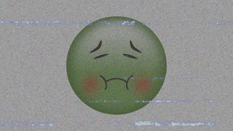 digital animation of tv static effect over sick face emoji against grey background