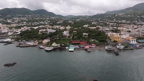 drone backward, establish italian island ischia, cloudy day, travel destinations