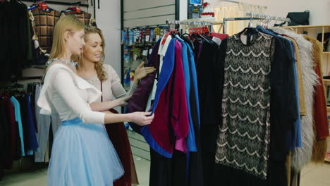 Young-Woman-Chooses-A-Dress-In-A-Store-6