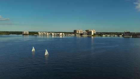 aerial pan view of small sailboaters