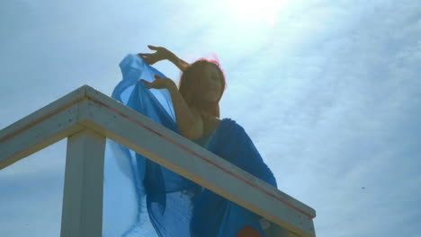 happy woman on sky background. backlight woman portrait. low angle view