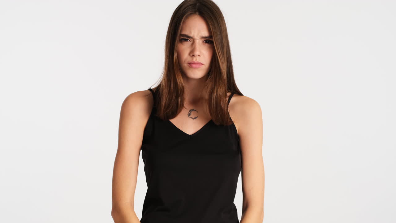 Caucasian furious woman posing in front of camera.