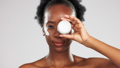 Face,-skincare-and-black-woman-with-cream