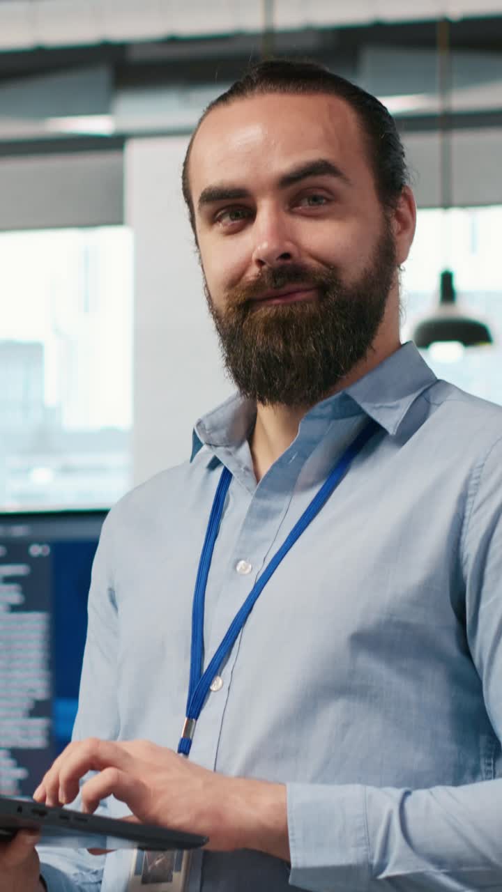 Vertical video System administrator in office developing software applications