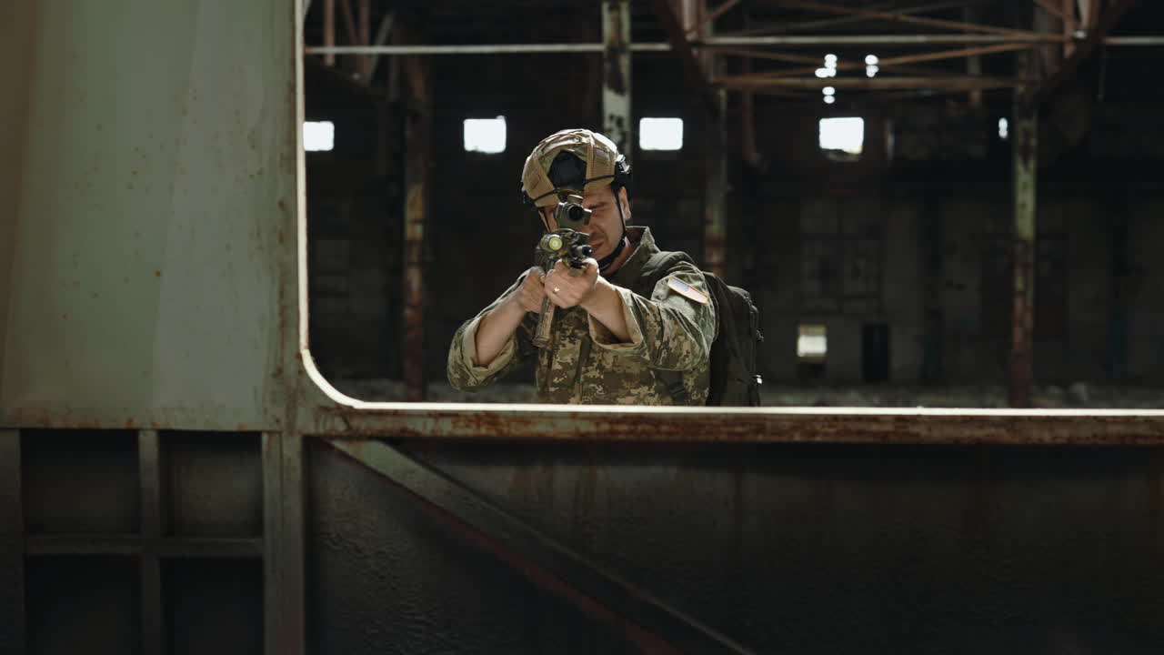 Soldier aiming with a rifle in a ruined building