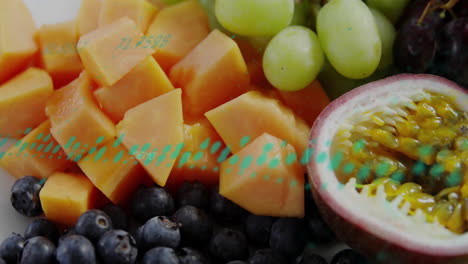 processing data animation over fresh papaya, grapes, and blueberries assortment