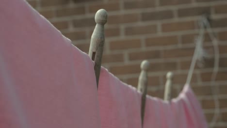 washing hanging on the line with wooden pegs