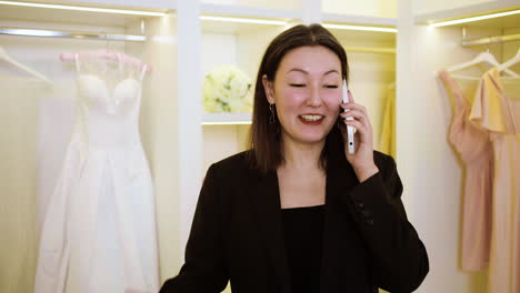 asian woman in wedding dress shop