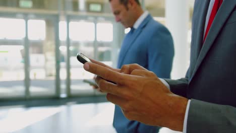 businessman using mobile phone in a modern office 4k