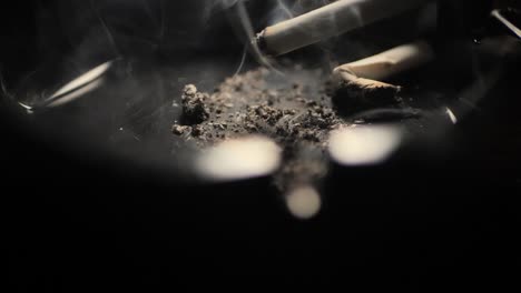 Close-up-smoking-cigarette-on-man-hand