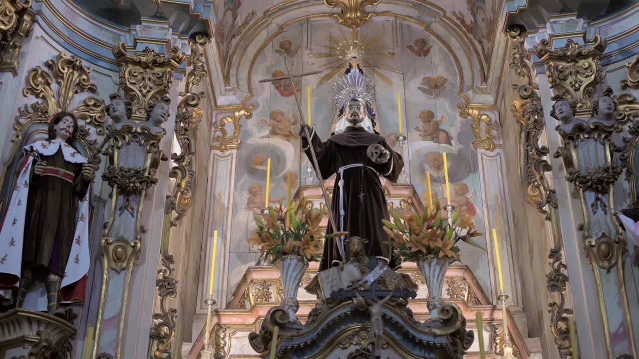 Close-up of the altar inside Igreja de São Francisco de Assis, revealing intricate religious details in Ouro Preto, Brazil