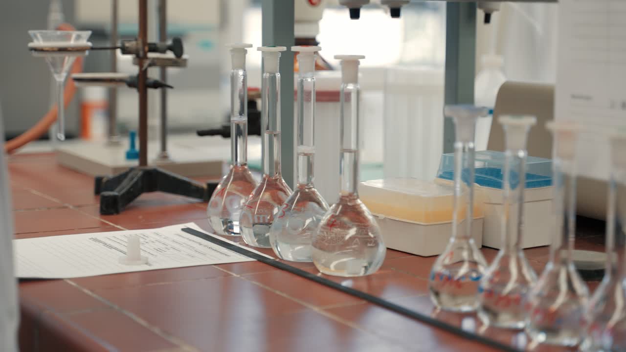 A row of transparent liquid fluids in the laboratory