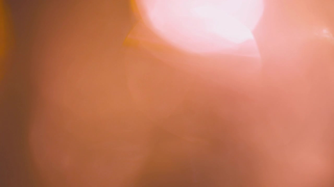 Gentle Shifting Warm Bokeh Light Leaks Background