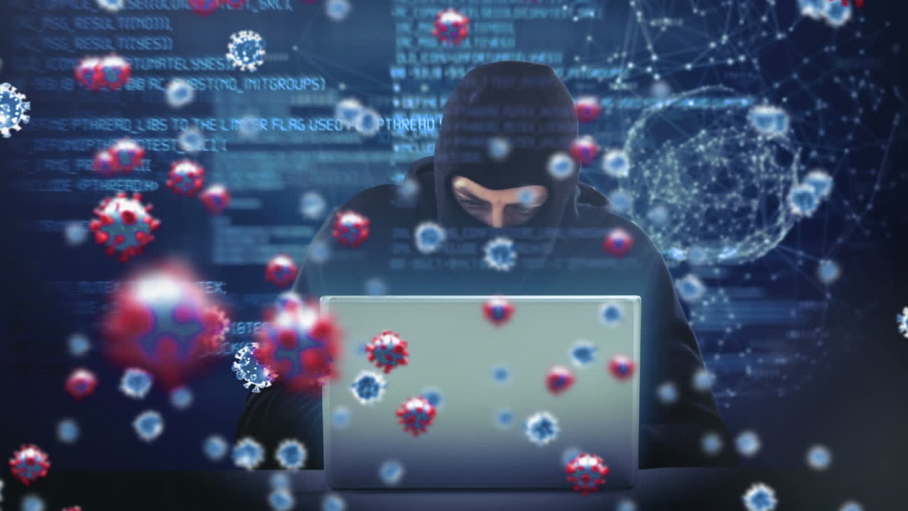 animación de las células macro covid19 sobre un hombre que lleva una balaclava, usando una computadora portátil