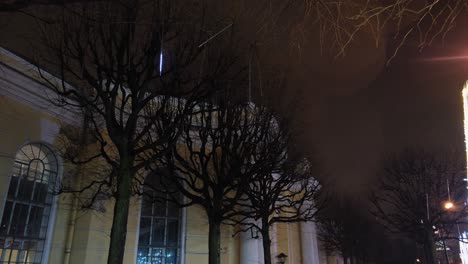 Winter Night Cityscape with Trees and Buildings