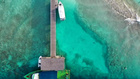 dock in the maldives w crystal clear water