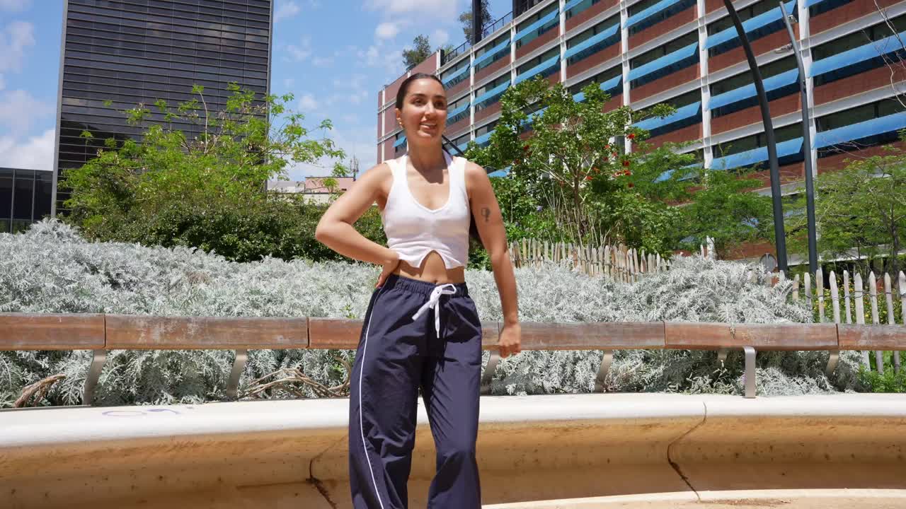 Woman dancing in an urban park